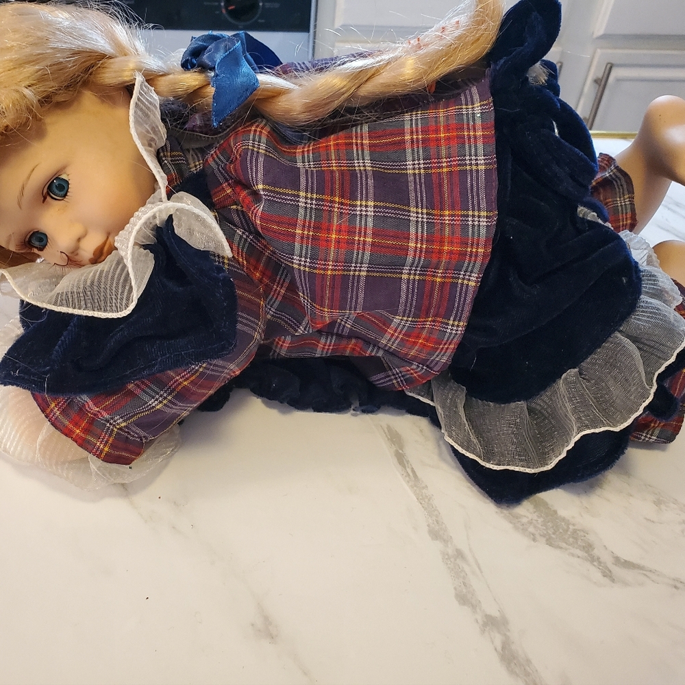 Rose 5000 Blonde Doll Laying On Quilt.